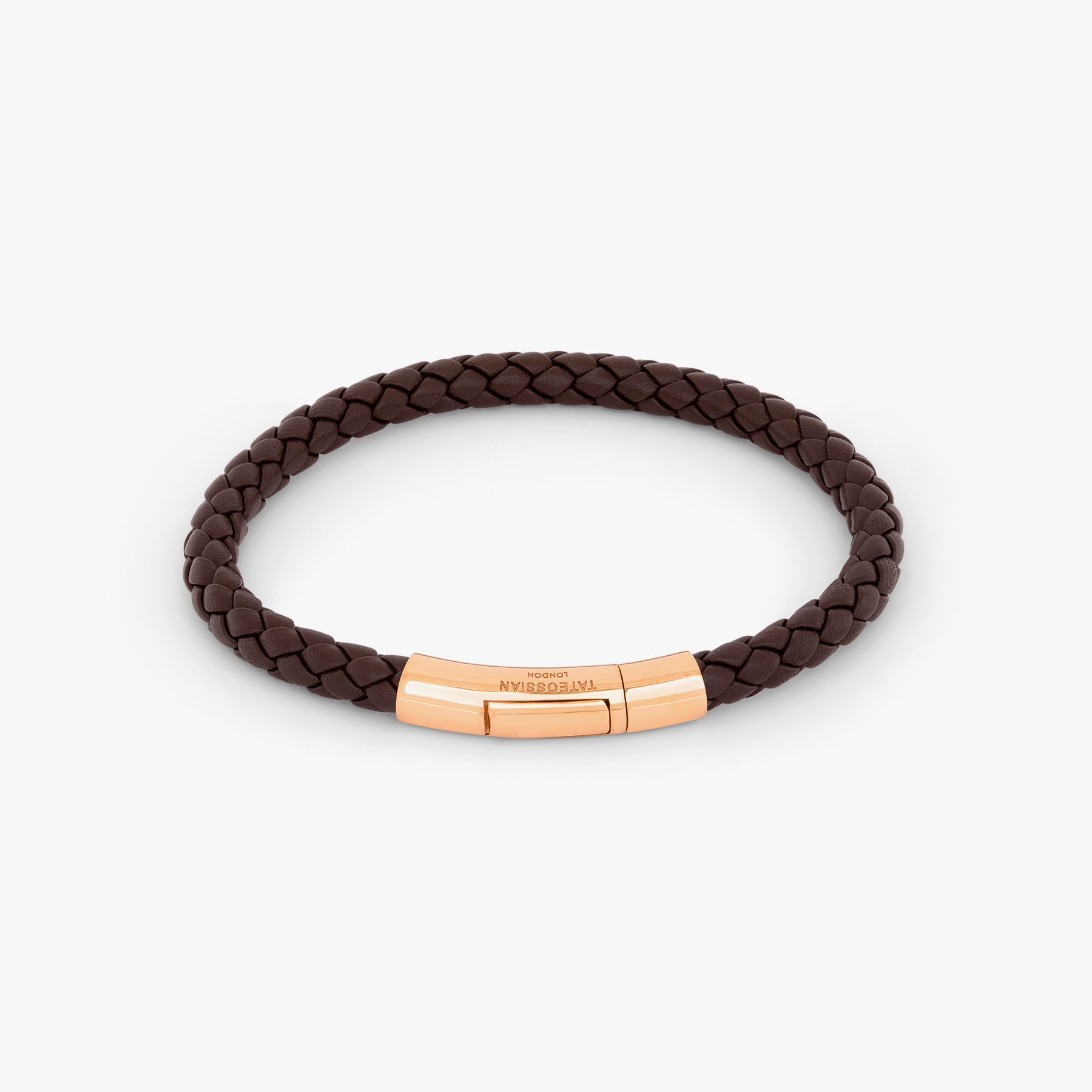 A brown leather bracelet with a rose gold clasp, hand-wrapped in a classic braid design. 18k Rose Gold 