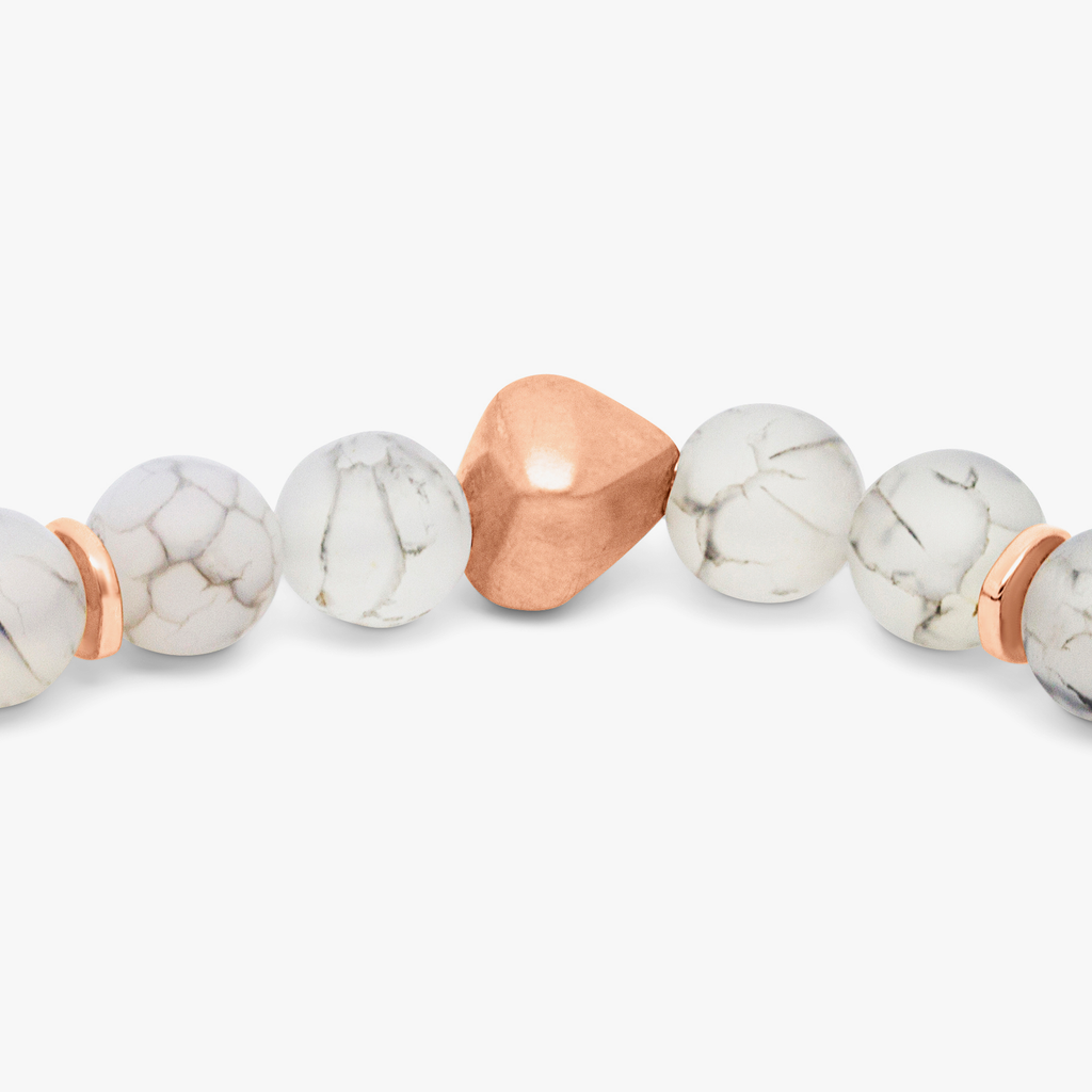 A bracelet featuring a mix of frosted fire agate and raw volcanic lava beads, with rose gold-coloured sterling silver detailing.