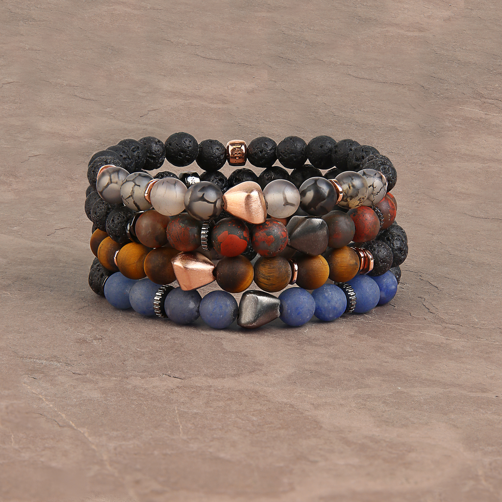 A bracelet featuring a mix of frosted fire agate and raw volcanic lava beads, with rose gold-coloured sterling silver detailing.