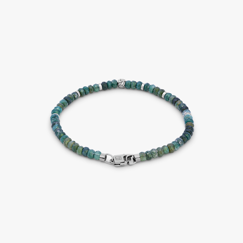 A beaded bracelet with green moss agate beads and silver accents, finished with a rhodium silver knot bead and a matching lobster clasp.