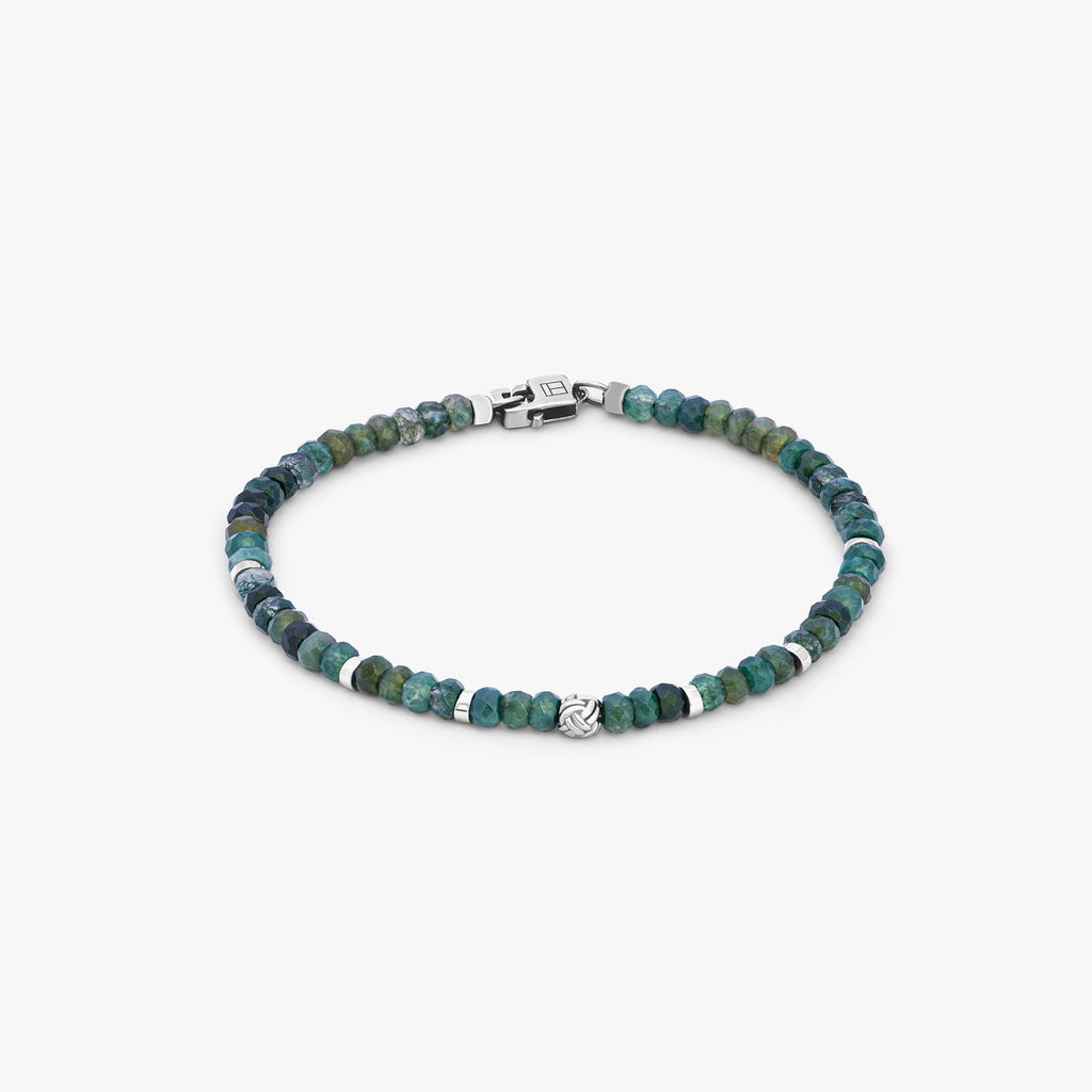 A beaded bracelet with green moss agate beads and silver accents, finished with a rhodium silver knot bead and a matching lobster clasp.