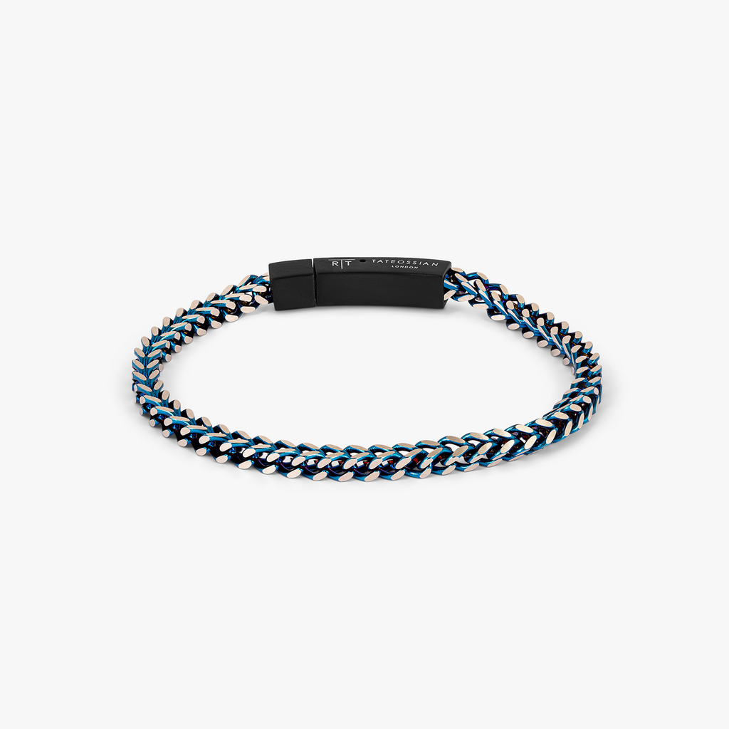 Chevron Click Bracelet In Matte Blue Black with chevron-patterned blue stainless steel chain and matte black clasp.