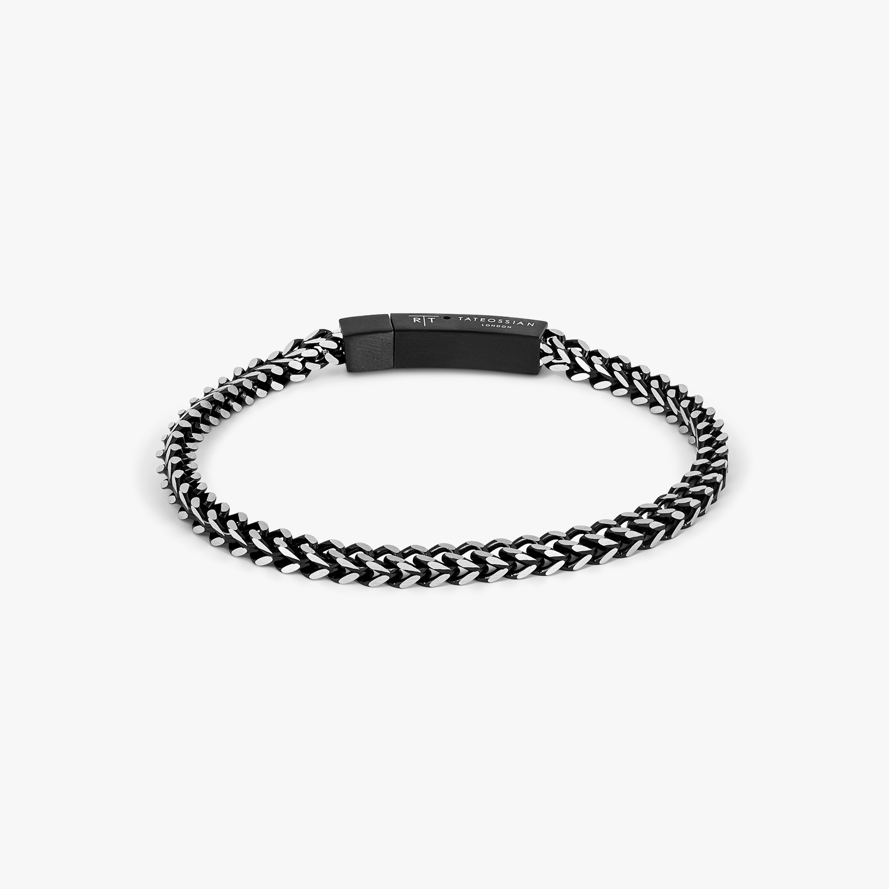 Chevron Click Bracelet In Matte Black featuring chevron-patterned black stainless steel chain with matte black clasp.