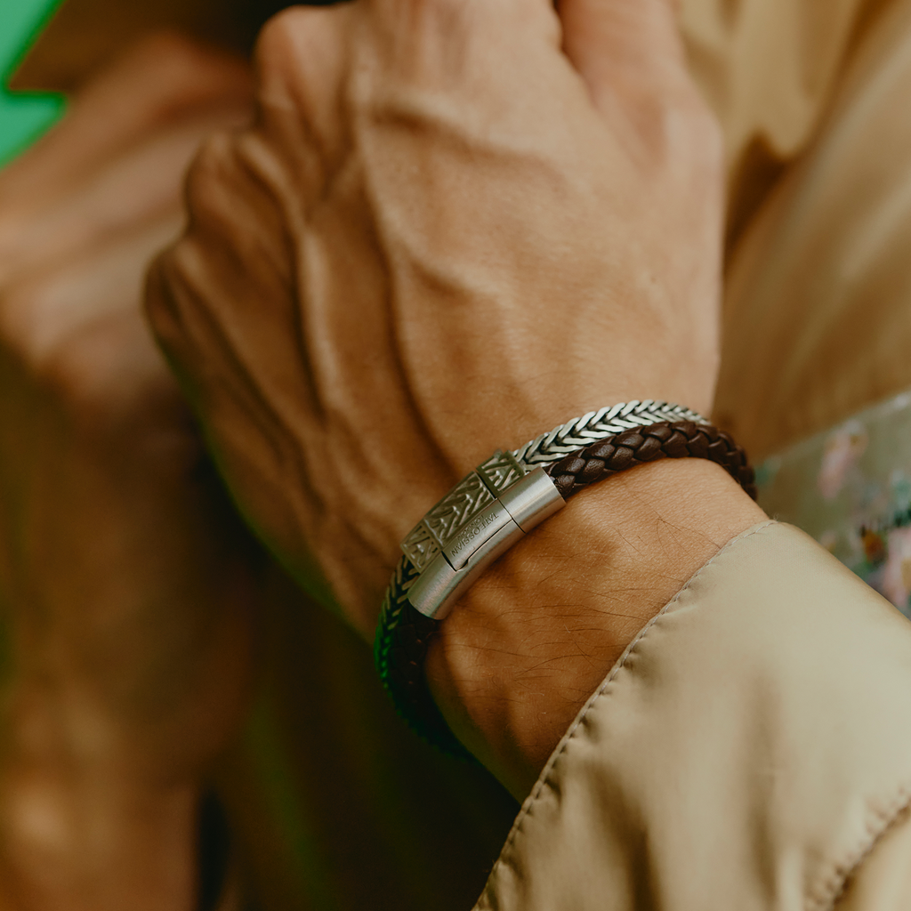 Charles Click Pelle Bracelet In Rhodium & Brown Leather on wrist with woven brown leather and rhodium clasp close-up.