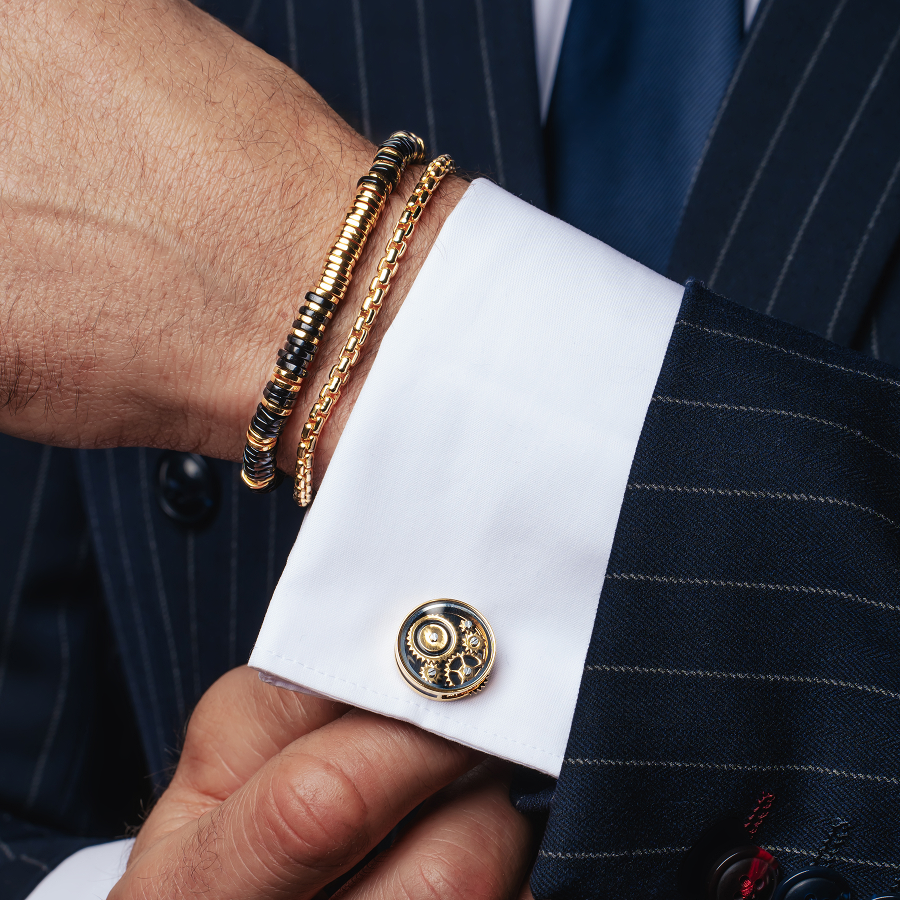 Carousel Gear Cufflinks In Yellow Gold Plated Base Metal With Black Enamel