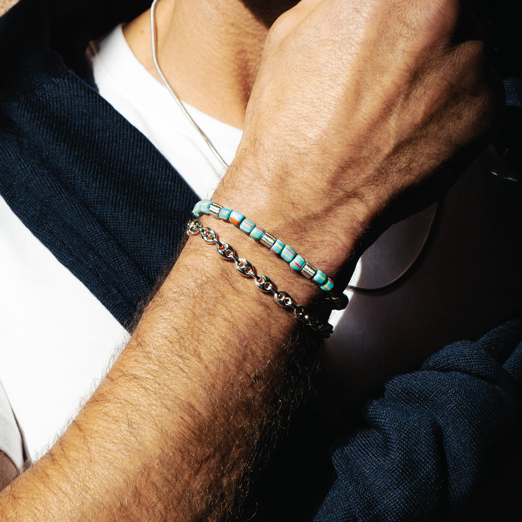 Java Stripes bracelet in rhodium-plated sterling silver with sky blue striped Java glass beads and patterned silver accents.