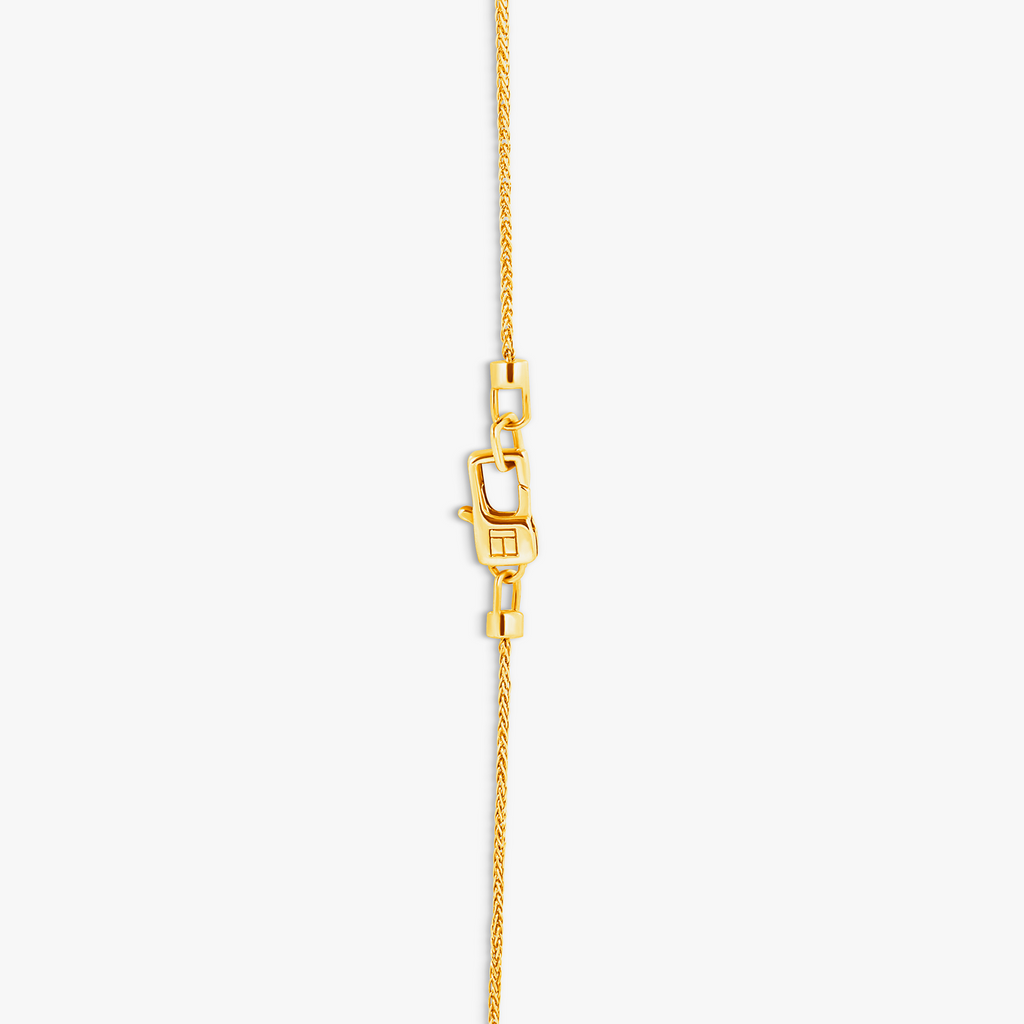 Paros Evil Eye necklace in yellow gold plating with sapphire-set iris, white enamel detail, and box chain.