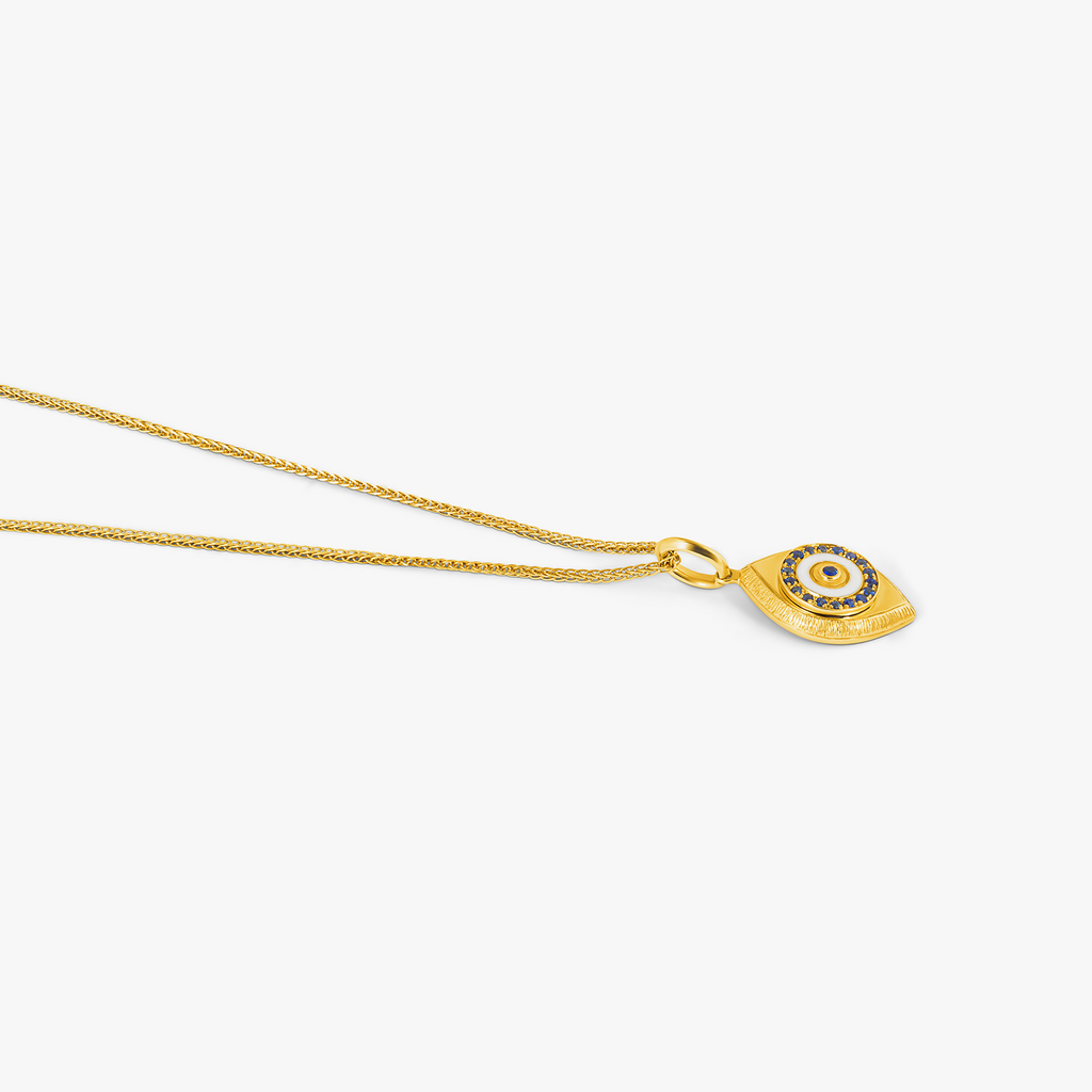 Paros Evil Eye necklace in yellow gold plating with sapphire-set iris, white enamel detail, and box chain.