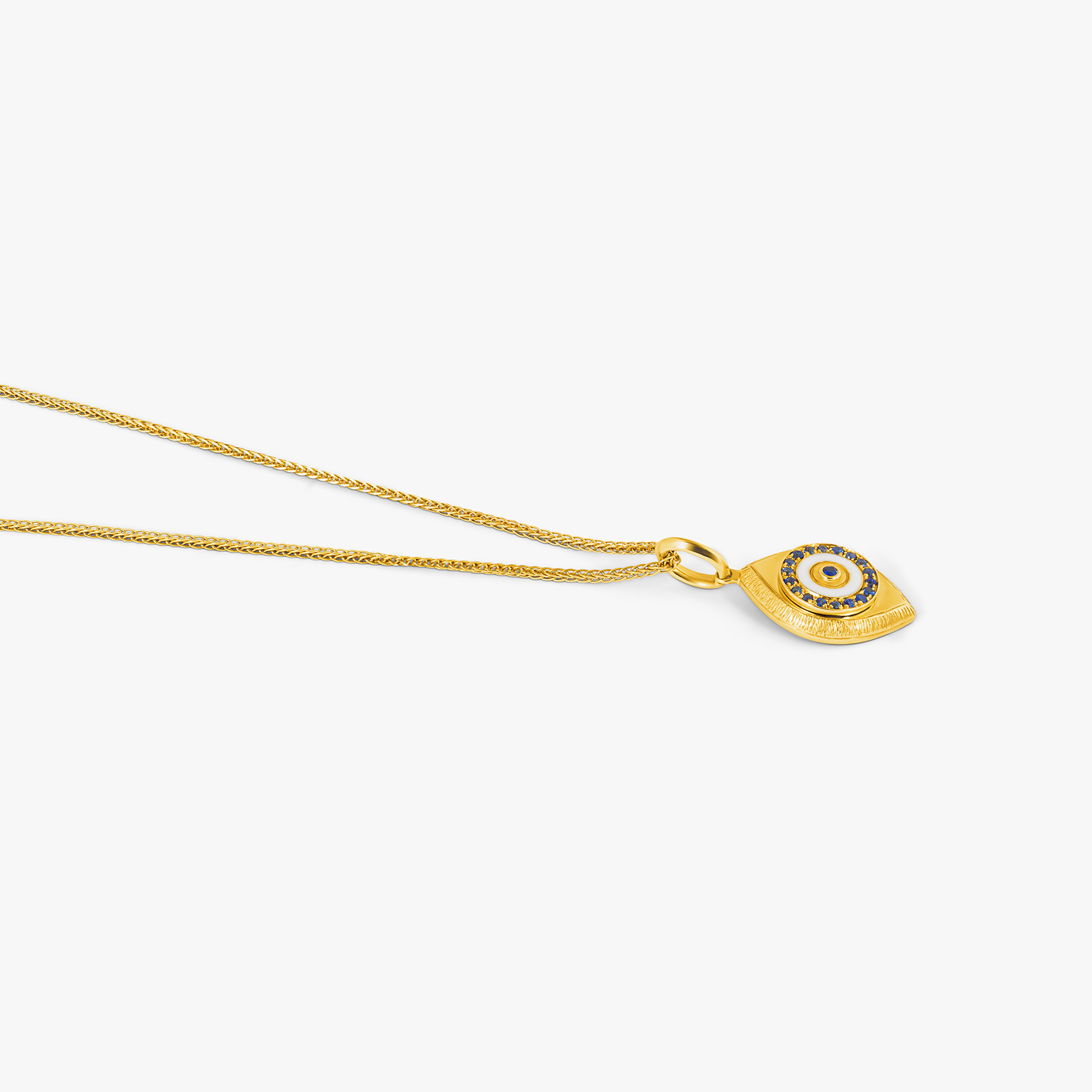 Paros Evil Eye necklace in yellow gold plating with sapphire-set iris, white enamel detail, and box chain.