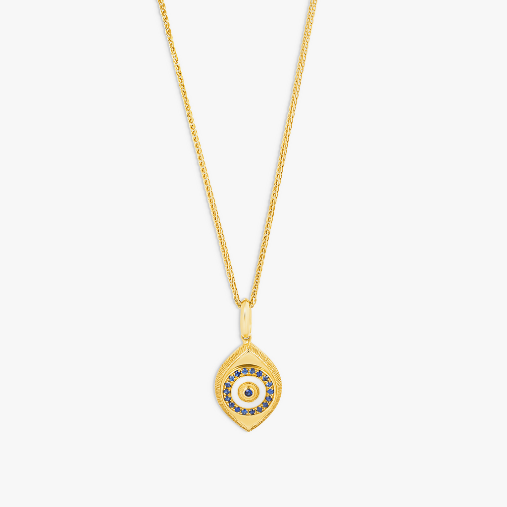 Paros Evil Eye necklace in yellow gold plating with sapphire-set iris, white enamel detail, and box chain.