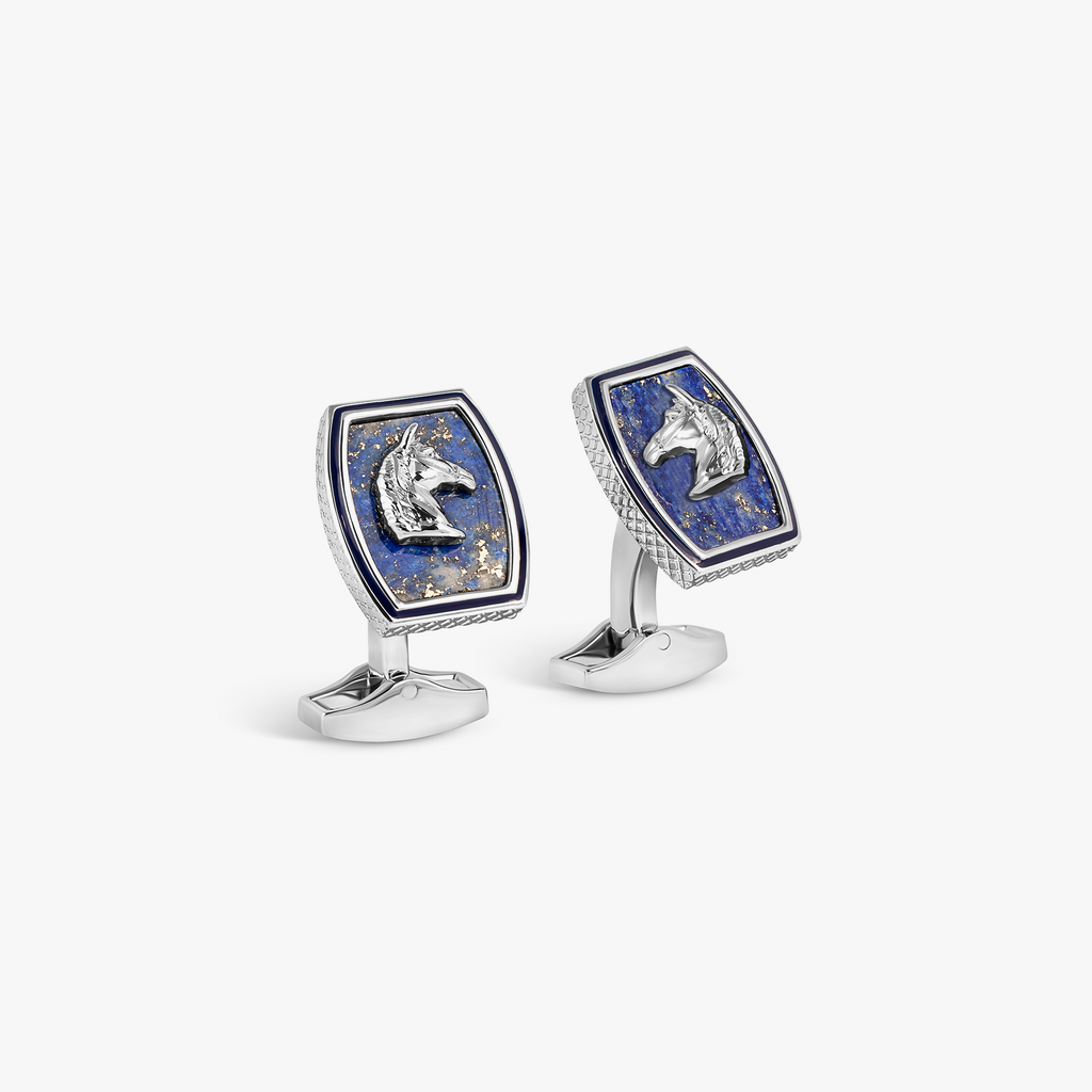 A pair of palladium plated cufflinks featuring an Ascot-inspired horse design with a blue lapis background and navy hand-painted enamel border.