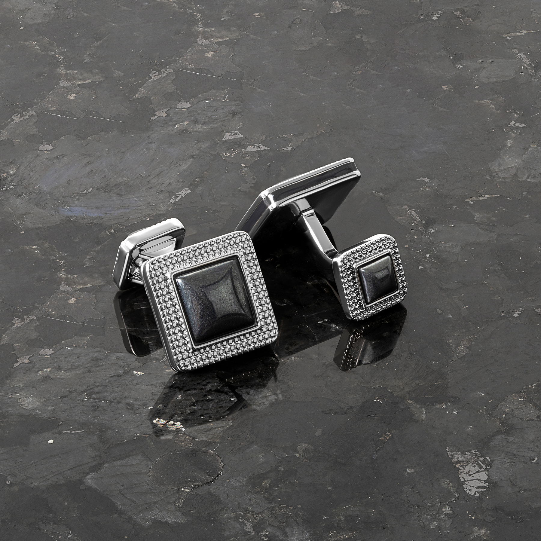 Duo cabochon cufflinks with hematite in palladium-plated metal, featuring square design with double-sided domed stone ends.
