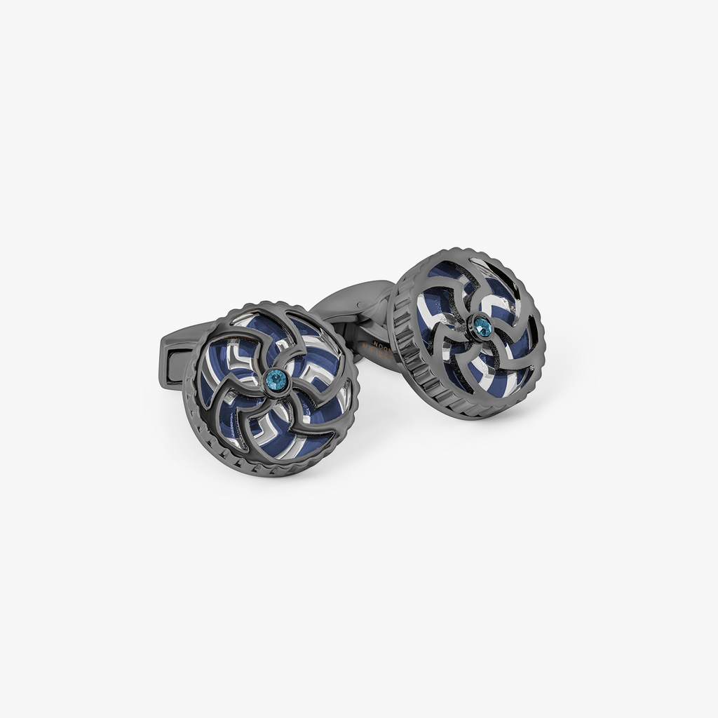 Rotating Trinity cufflinks in navy blue enamel with Swarovski crystals, featuring a Celtic-inspired Triskelion and Trinity Knot design in a gunmetal and palladium finish.