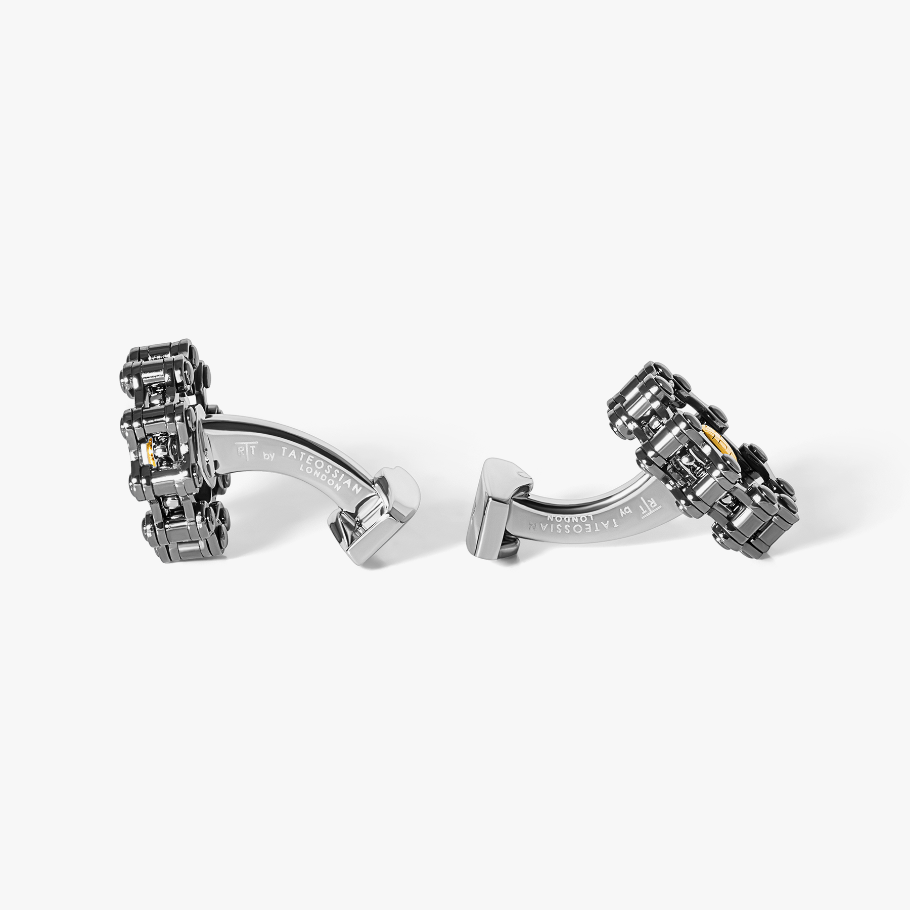 Men’s luxury cufflinks styled after a bicycle chain with articulated gunmetal links and engraved gold plated centre