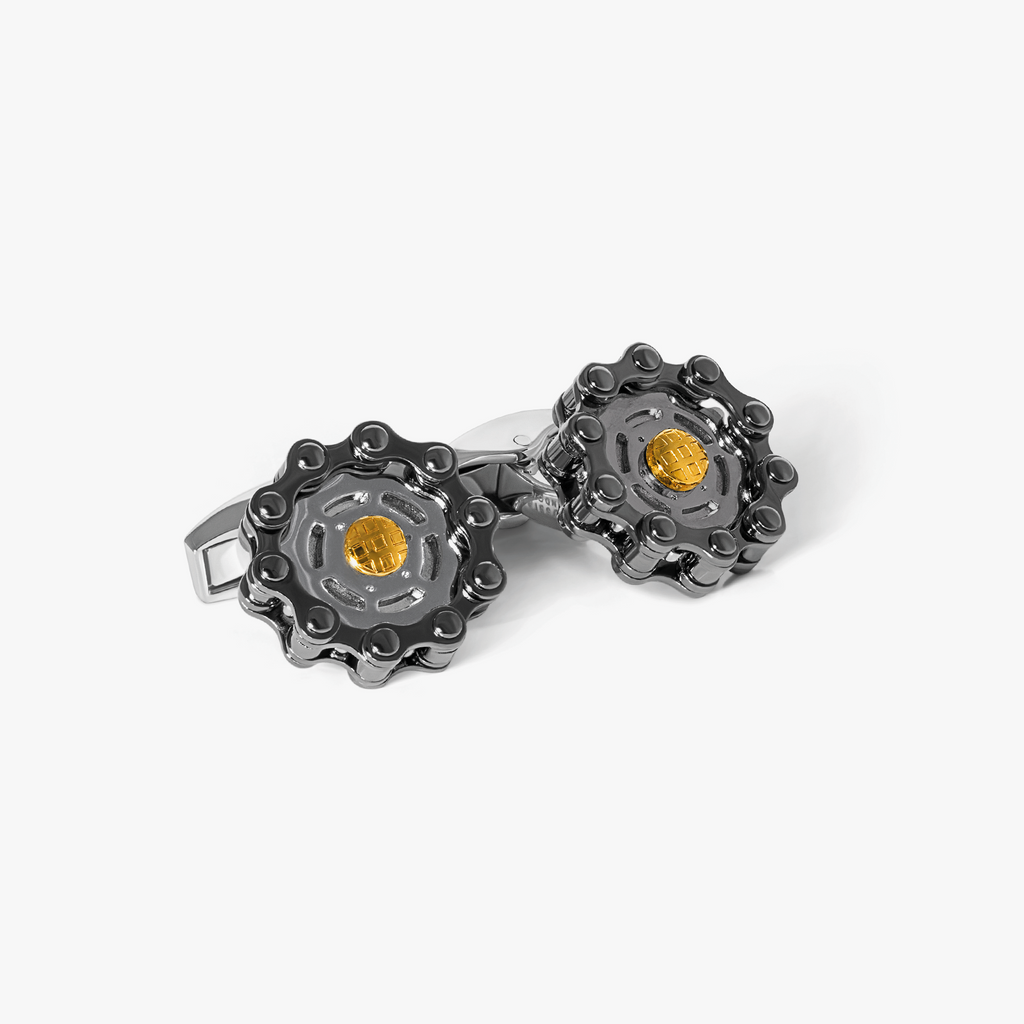 Bici Gear cufflinks in gunmetal and yellow gold with interlocking bike chain design and engraved gold centre detail.