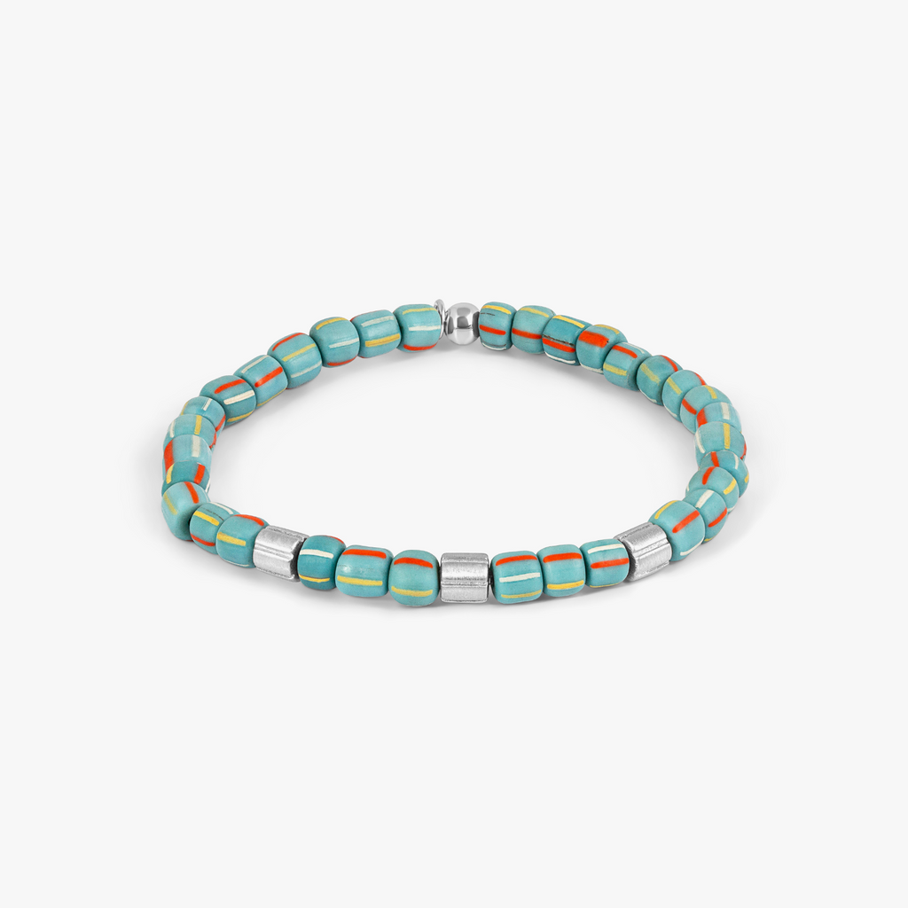 A rhodium-plated sterling silver bracelet with sky blue java glass beads and silver accents.