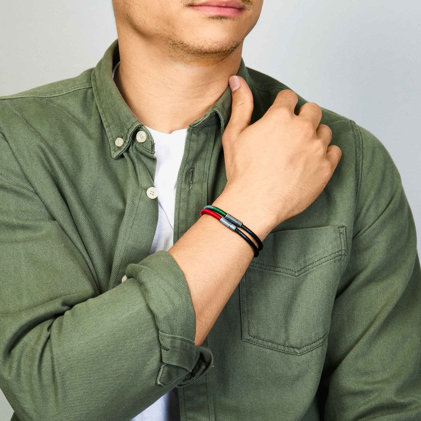 Rainbow Pop bracelet in black leather and green thread wrap with black rhodium plated silver