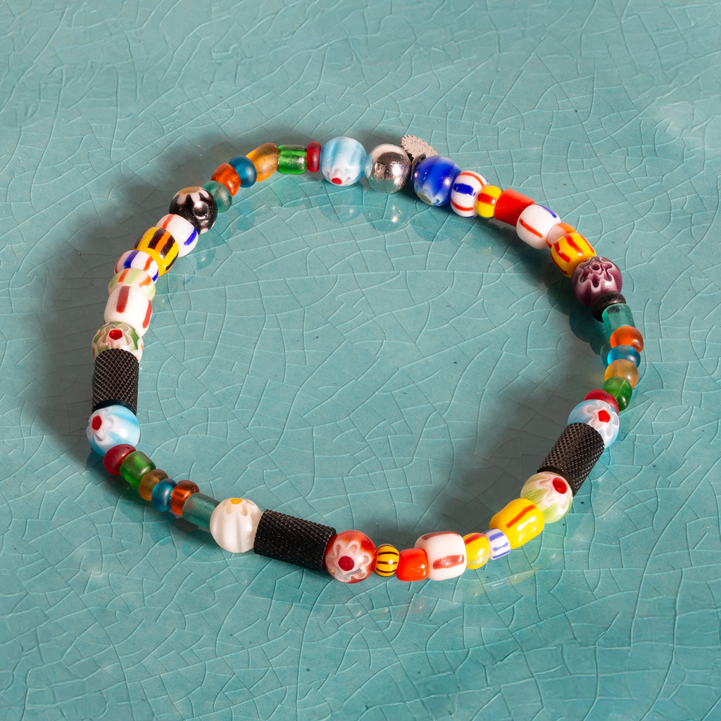 Tutti Frutti bracelet with multicolour frosted and African glass beads, Millefiori accents, and black IP-plated stainless steel clasp engraved with Giza pattern.