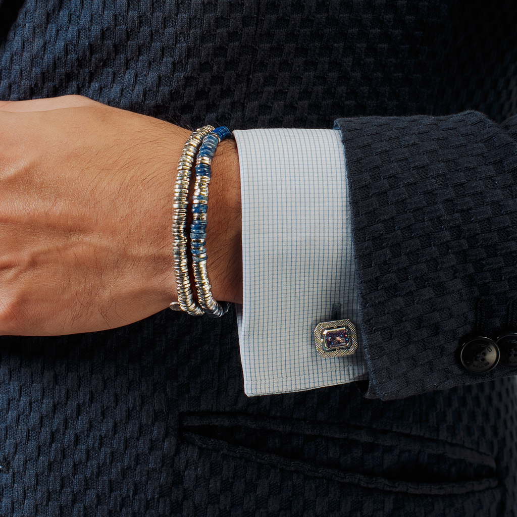 A rhodium-plated sterling silver bracelet with sodalite beads arranged in a pattern that resembles a starry night sky.