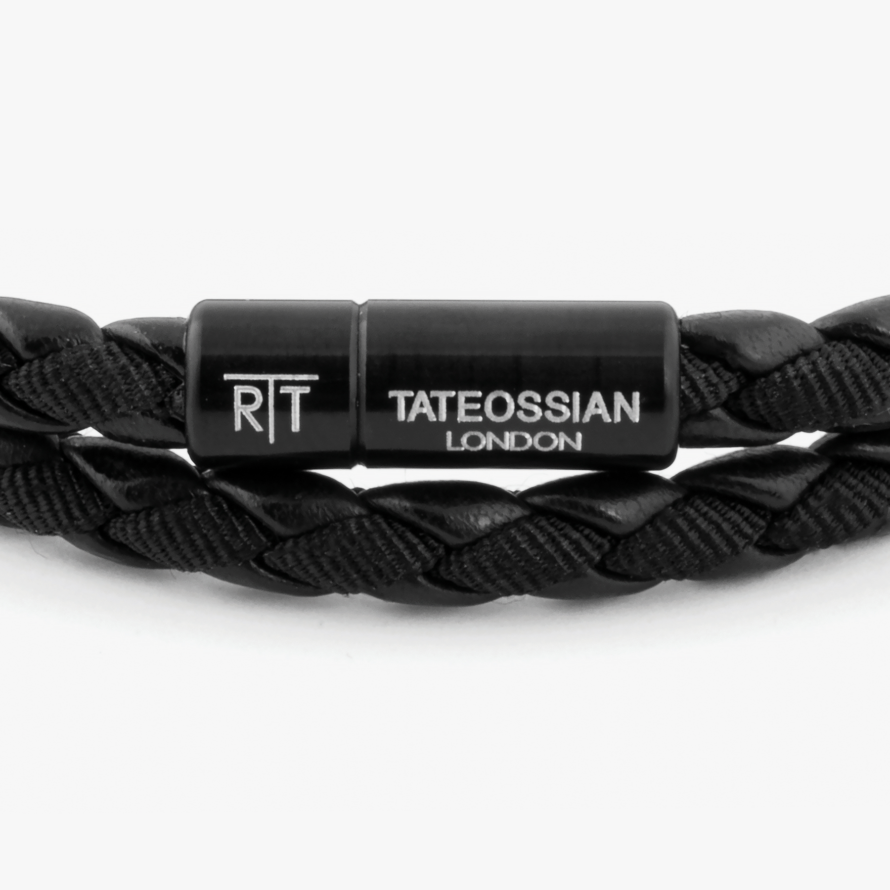 Chelsea Leather Bracelet In Black With Aluminium Clasp showing close-up of braided black leather and black anodised aluminium clasp with engraving.