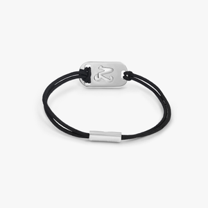 Silver Capricorn bracelet with black cord