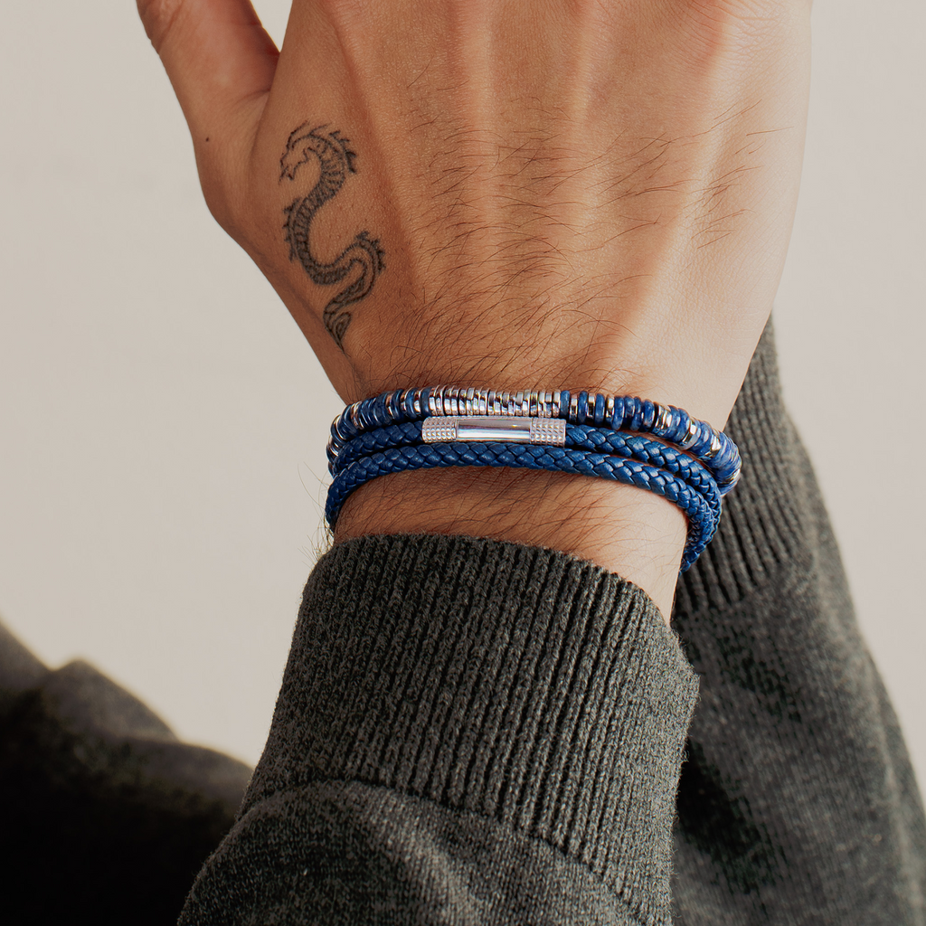 A rhodium-plated sterling silver bracelet with sodalite beads arranged in a pattern that resembles a starry night sky.