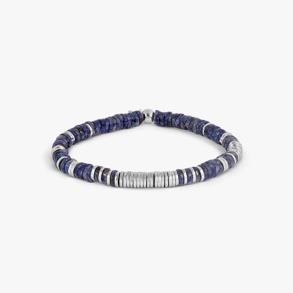 A rhodium-plated sterling silver bracelet with sodalite beads arranged in a pattern that resembles a starry night sky.