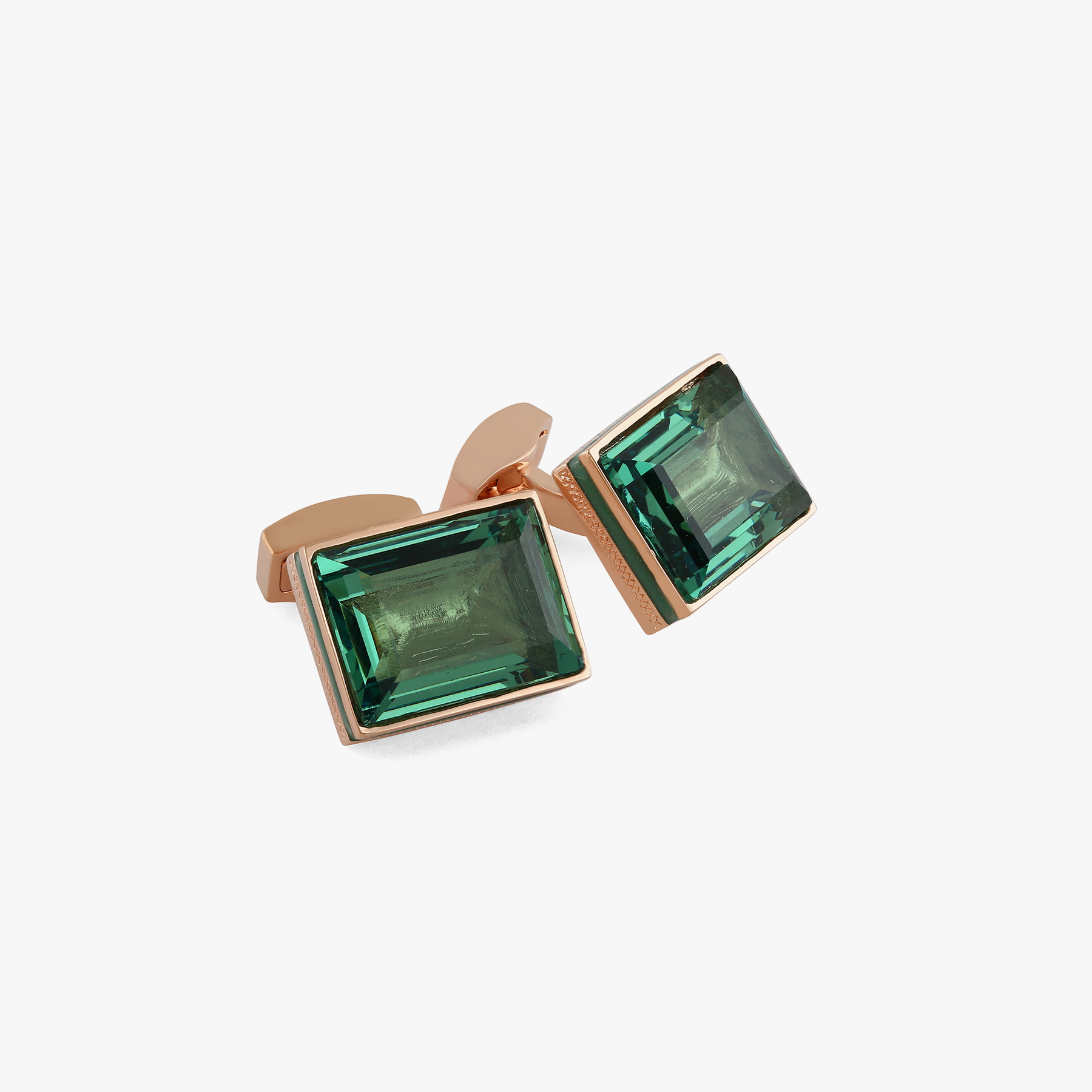 Rectangular Erinite cufflinks in green with rose gold plating, featuring emerald-cut crystal and turquoise enamel detail with diamond pattern.