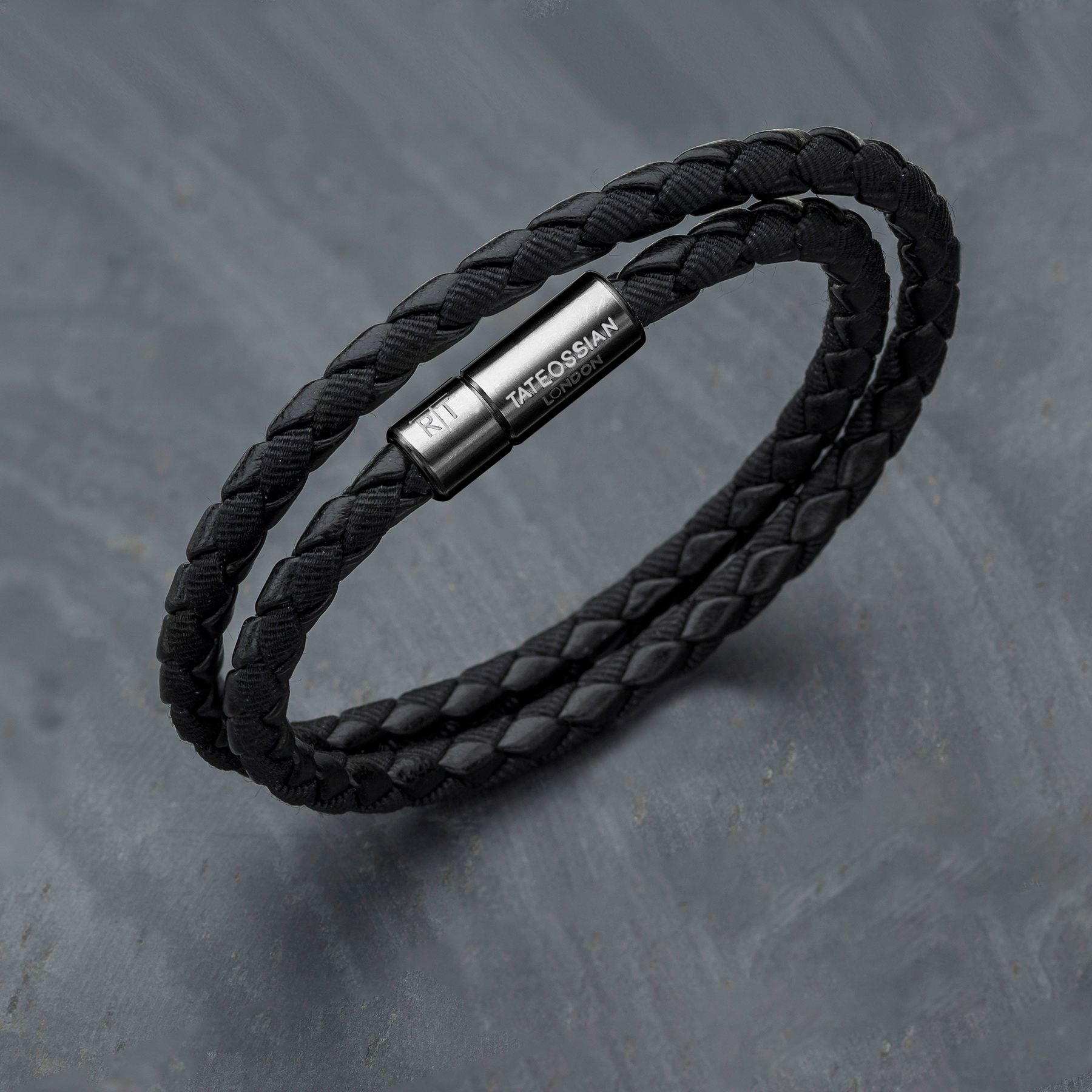 Chelsea Leather Bracelet In Black With Aluminium Clasp featuring braided black fabric and leather with engraved black anodised clasp.