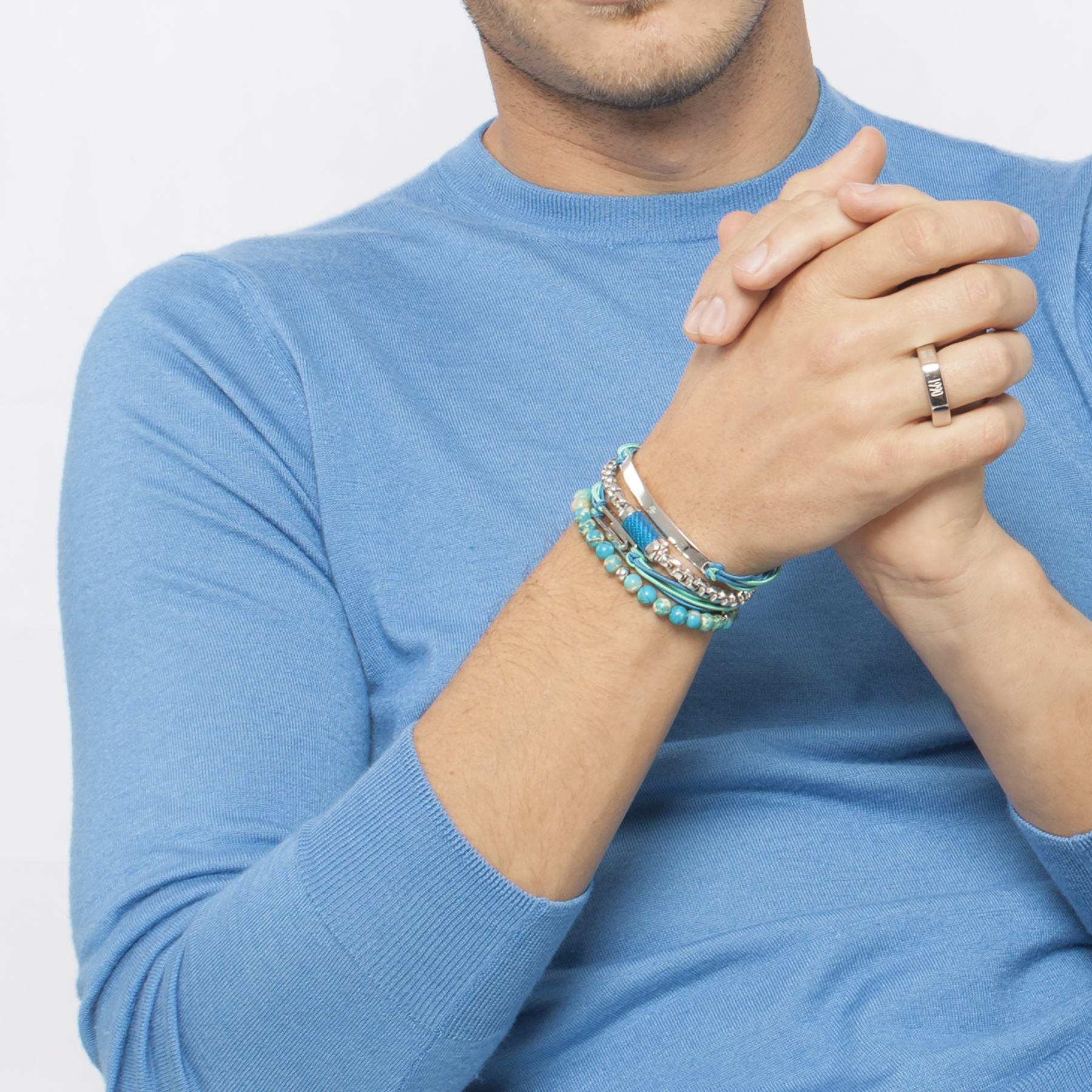 A bracelet with blue Impression Jasper beads and silver-colored discs.