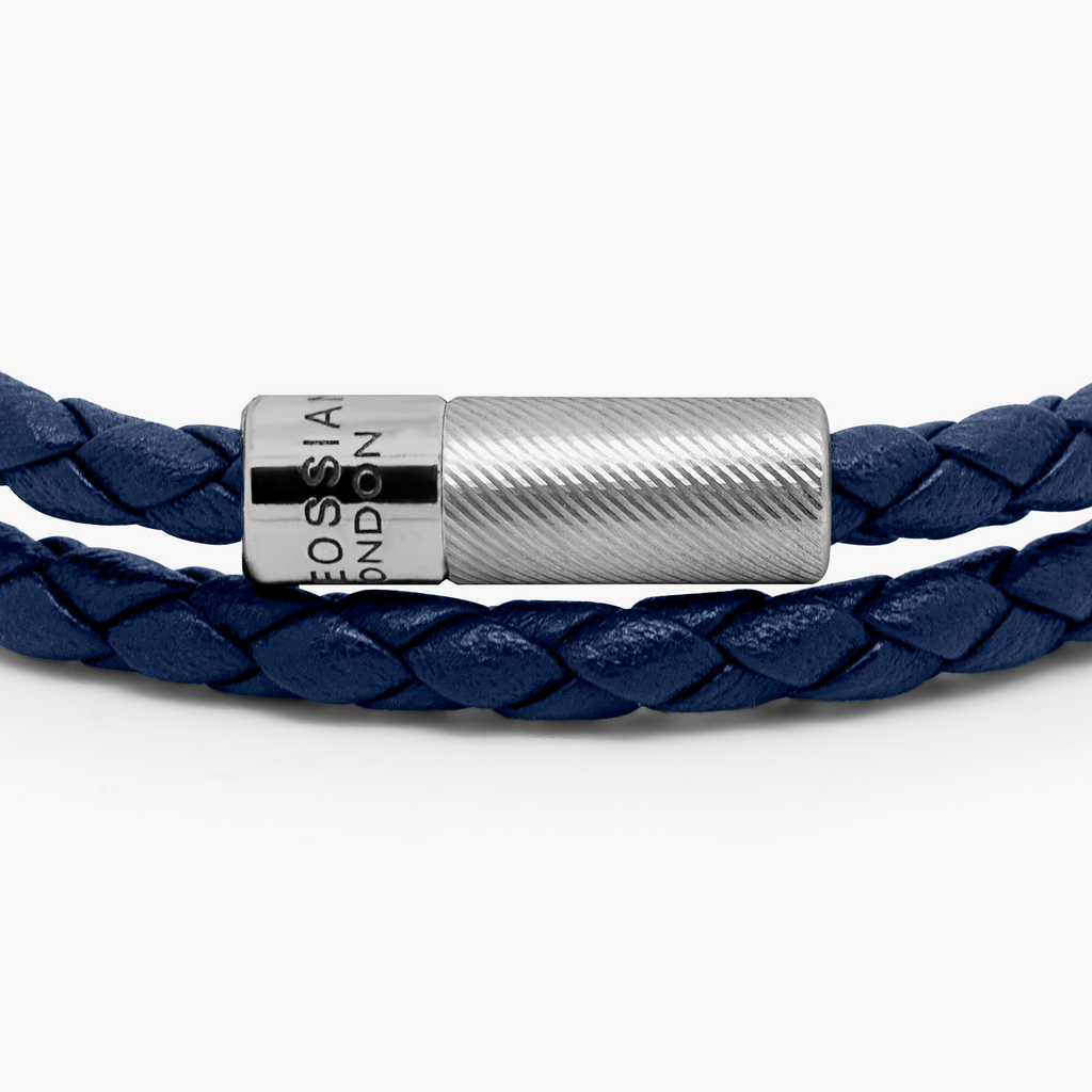 A navy blue double wrap leather bracelet with a sterling silver clasp.