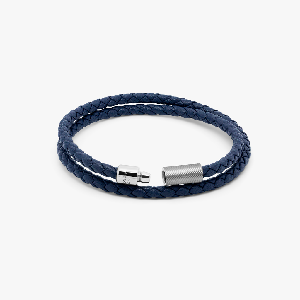 A navy blue double wrap leather bracelet with a sterling silver clasp.