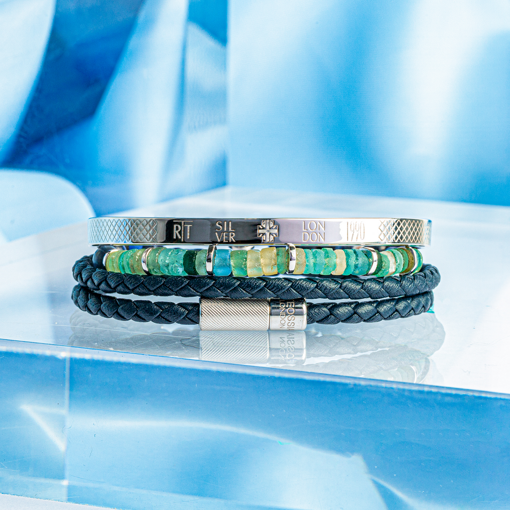 A navy blue double wrap leather bracelet with a sterling silver clasp.