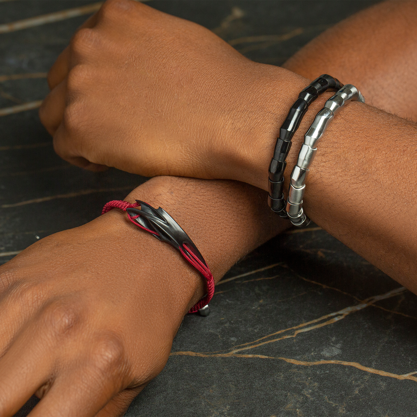 ZAHA HADID DESIGN Tyne bracelet in brushed black IP stainless steel and burgundy macrame