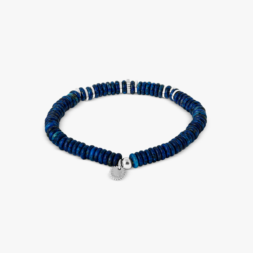 A blue beaded bracelet with rhodium plated sterling silver, featuring rondelle shaped blue lapis lazuli beads and gear discs.