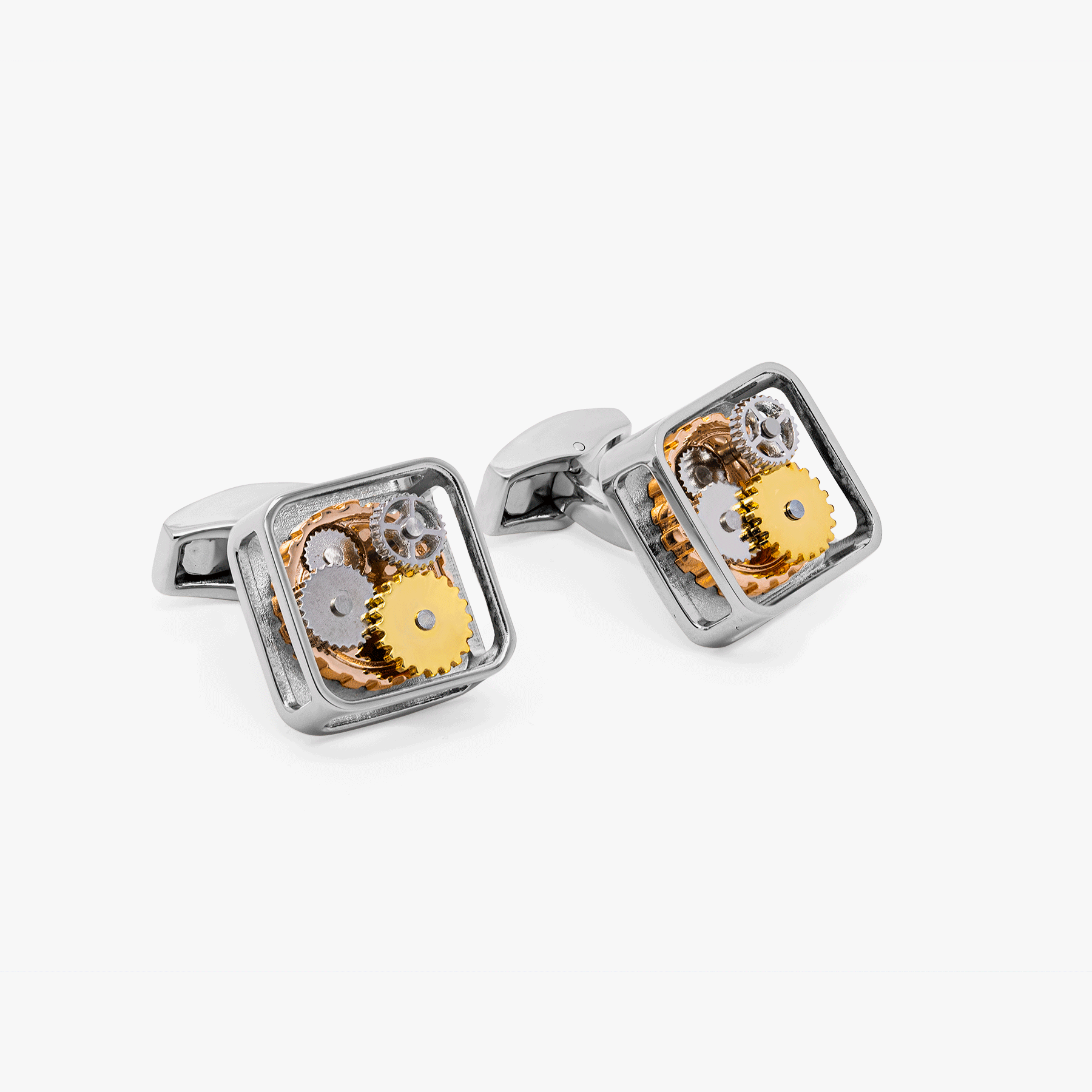 A pair of silver square gear cufflinks with palladium plating and visible mechanical gears inside.